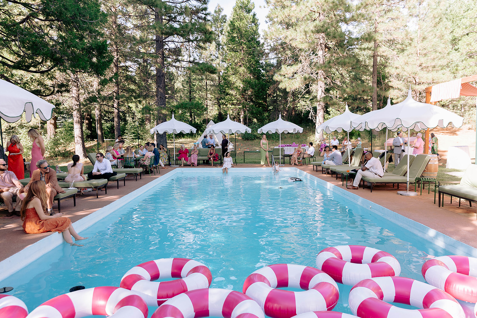 wedding pool with umbrellas and floaties